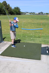 Young golfer at I love golf program
