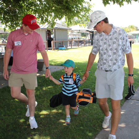 Coaches helping golfer.June25